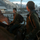 Ellie and Dina smile warmly at each other as they mount their horses and prepare to set off on a journey in the snowy mountains of Wyoming.